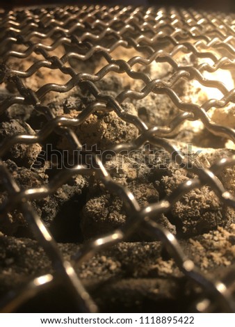 Close up steel grating on charcoal stove