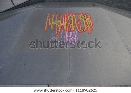 Drawing of Mauricio was here tagged in urban graffiti on a flat ramp
