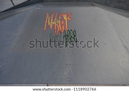 Drawing of Mack was here tagged in urban graffiti on a flat ramp