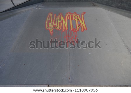Drawing of Quentin was here tagged in urban graffiti on a flat ramp