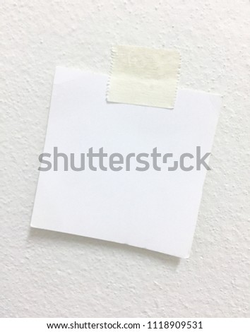 ripped note paper with adhesive tape on white background
