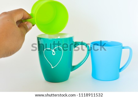 Plastic and ceramic mug isolated on white background.