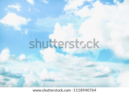 Soft blue sky background with clouds