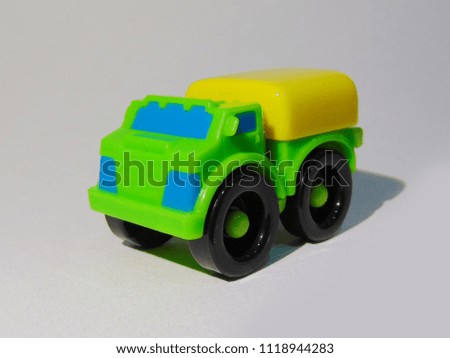 yellow green truck plastic toy on a white background   