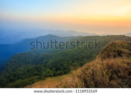 Panoramic view misty morning sunrise in mountain at north Thailand