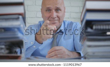 Pleased Businessman In Archive Room Smile And Pointing With Finger