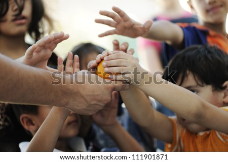 Humanitarian food for poor children in refugee camp Royalty-Free Stock Photo #111901871