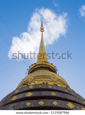 Beautiful Pagoda of Wat Phra That Lampang Luang on Blue sky cloud background in Nice day.