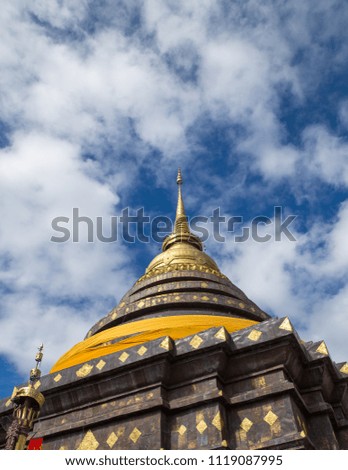 Beautiful Pagoda of Wat Phra That Lampang Luang on Blue sky cloud background in Nice day.