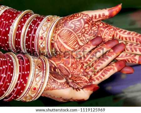 hands of bride while performing wedding rituals