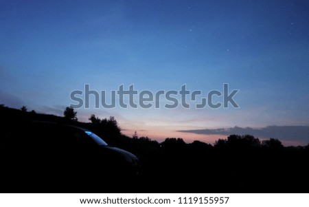 Night sky view with shining stars and clouds