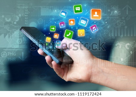 Hand using phone with bouncing colorful application and global reports and graphs concept
