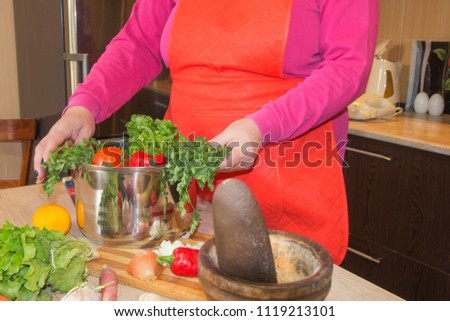 Woman hands cutting vegetables in the kitchen. Woman in kitchen preparing vegetables