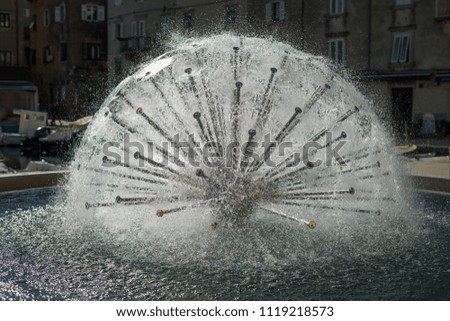 Fountain in Cres (Croatia), shape of a sphere in direct sunlight