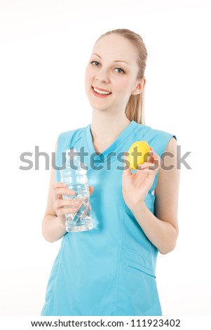 Young caucasian female fitness model with the water and lemon on white backgrounds