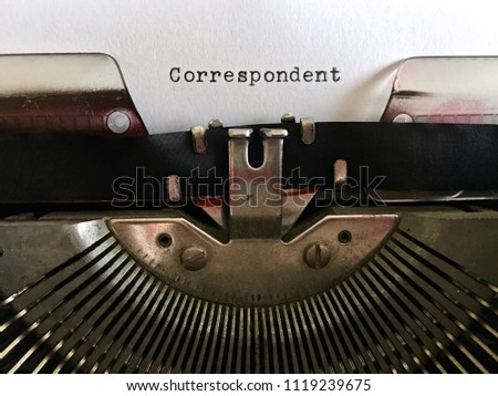 Correspondent, occupation label typed in black ink on vintage manual typewriter machine