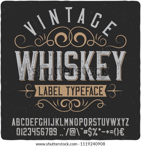 Vintage decorative font named "Whiskey". Good handcrafted western typeface for labels, t-shirts, posters, greeting cards etc. Royalty-Free Stock Photo #1119240908
