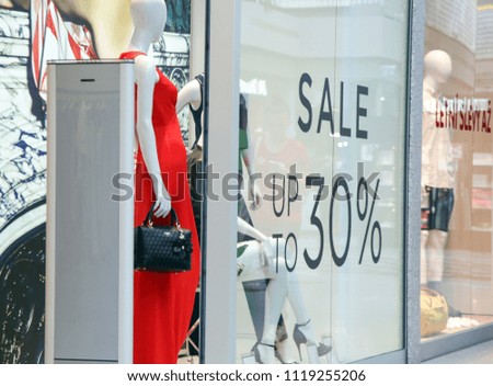 Sale sign at the window shop in the mall