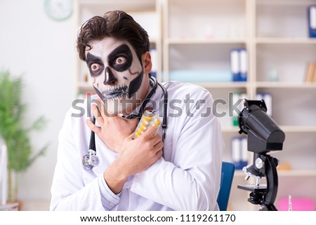 Scary monster doctor working in lab Royalty-Free Stock Photo #1119261170