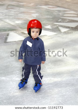 Young boy learning to skate