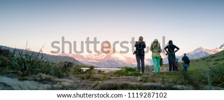 Photographers looking at Matterhorn Mountain in summer Switzerland