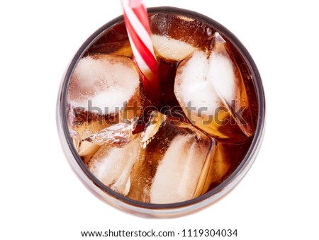 Cola in glass with straw and ice cubes isolated on white background. Soda with bubbles isolated on white. Refreshing non-alcoholic drink