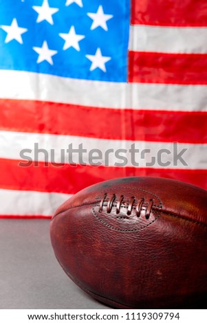 American football ball and old glory flag. Copy space. USa. Patriotic. 