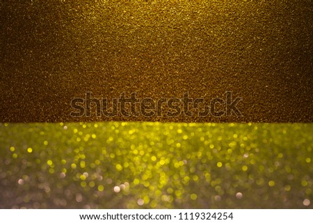 Abstract background filled with shiny dark gold glitter