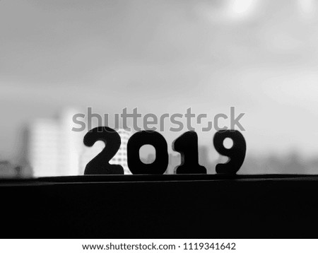 New Year 2019 concept lettering silhouette on sky background
