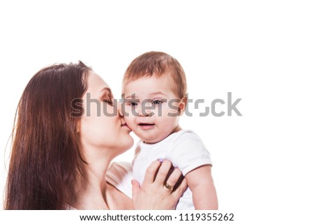 Mother kissing her cute baby