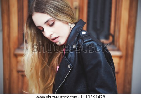 portrait of a beautiful young blonde woman with long hair