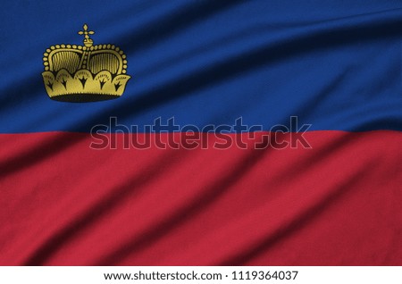 Liechtenstein flag  is depicted on a sports cloth fabric with many folds. Sport team banner