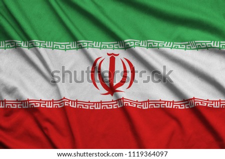 Iran flag  is depicted on a sports cloth fabric with many folds. Sport team banner Royalty-Free Stock Photo #1119364097