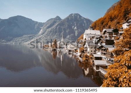 
Scenic picture-postcard view of famous Hallstatt mountain village in the Austrian Alps with passenger ship in beautiful morning light at sunrise on a sunny day in summer, Austria