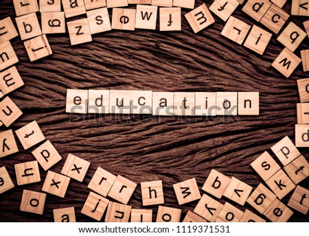 Education word written cube on wooden background. Vintage concept.