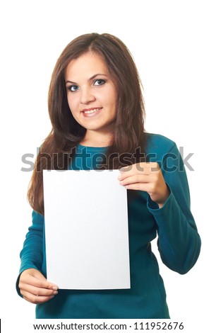 Attractive smiling girl with long dark hair in a blue blouse holding a poster. Isolated on white background
