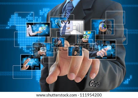 businessman hand pushing a button streaming images on a touch screen interface Royalty-Free Stock Photo #111954200