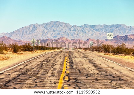 Route 66 crossing the Mojave Desert (near Amboy), California, United States . The road is under repairs. Royalty-Free Stock Photo #1119550532