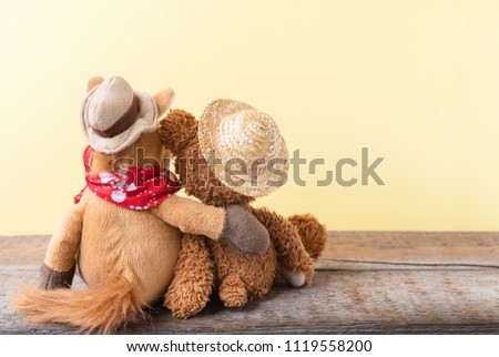 Friendship forever, two plush toys holding in one's arms.