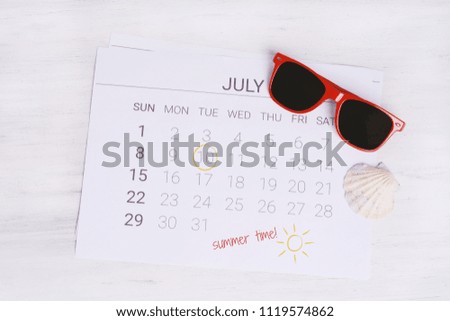 Summer Calendar Schedule with summer beach accessories. Holiday concept.