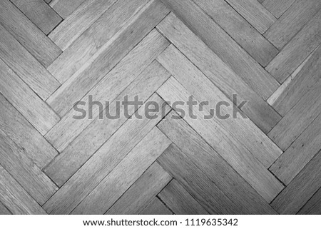 wood parquet (chevron old) Texture of old parquet. Black and white image.