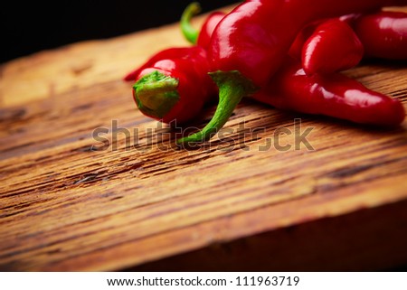 some chili peppers on a plate Royalty-Free Stock Photo #111963719