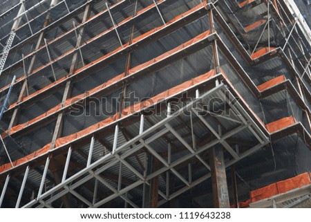 Construction of multy storey building. Skyscraper in process. View from ground.
