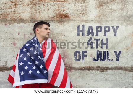 Happy 4Th Of July card. man is holding waving american USA flag, toned image