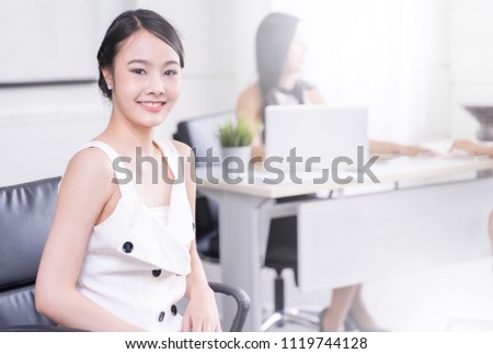 modern business woman stand in office with Colleagues are working, business teamwork concept.