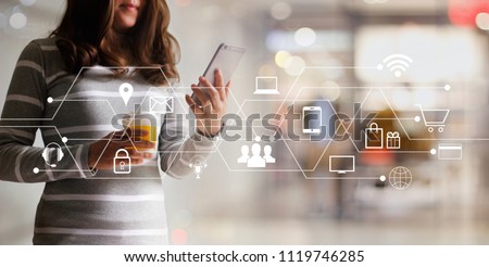 Woman using mobile payments online shopping and icon customer network connection. Digital marketing, m-banking and omni channel. Royalty-Free Stock Photo #1119746285