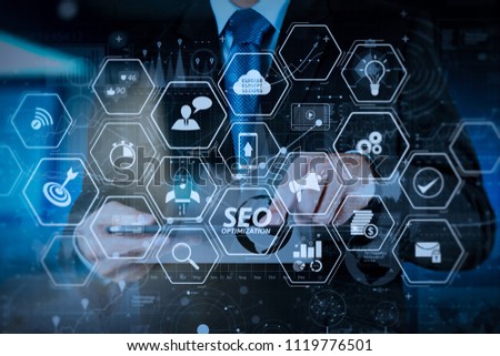 Seo Optimization for website with mobile website and Landing page virtual diagram.businessman hand working with modern technology and digital layer effect as business strategy concept