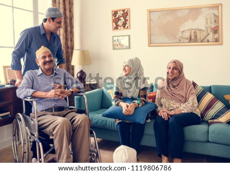Muslim family relaxing in the home Royalty-Free Stock Photo #1119806786