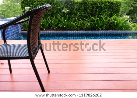 Sitting chair on wood floor for relax at the pool