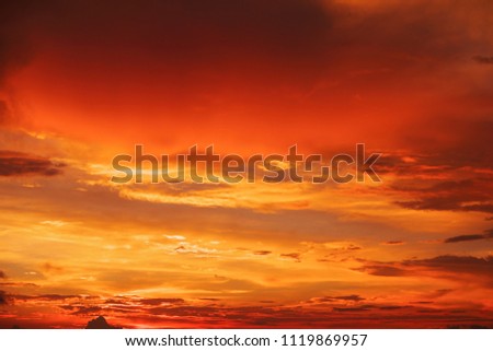 Beautiful bright colorful sky. Picture taken at sunset. Red-orange background with nice paints. Rare sunrise. Natural composition